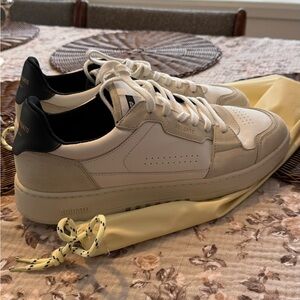 Axel Arigato Cream and Black Sneakers